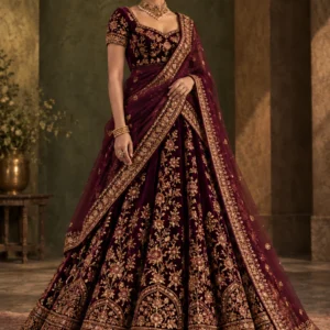 Adult model in a deep aubergine plum lehenga with antique gold embroidery and fully covered waist in a studio portrait